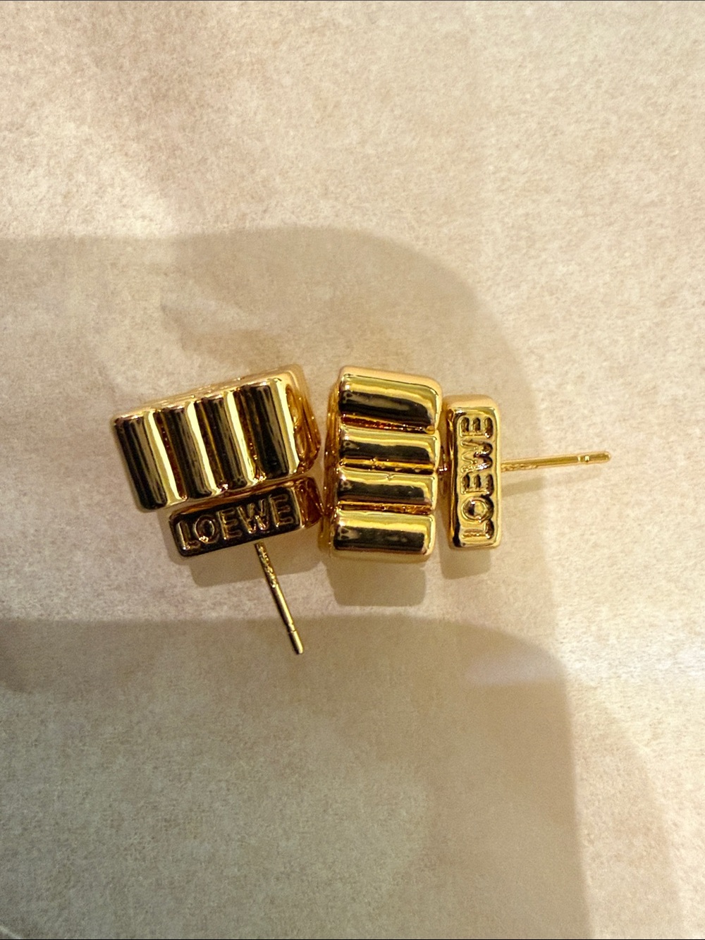 Gold Tone Ribbed Logo Stud Earrings - Picture 4 of 6